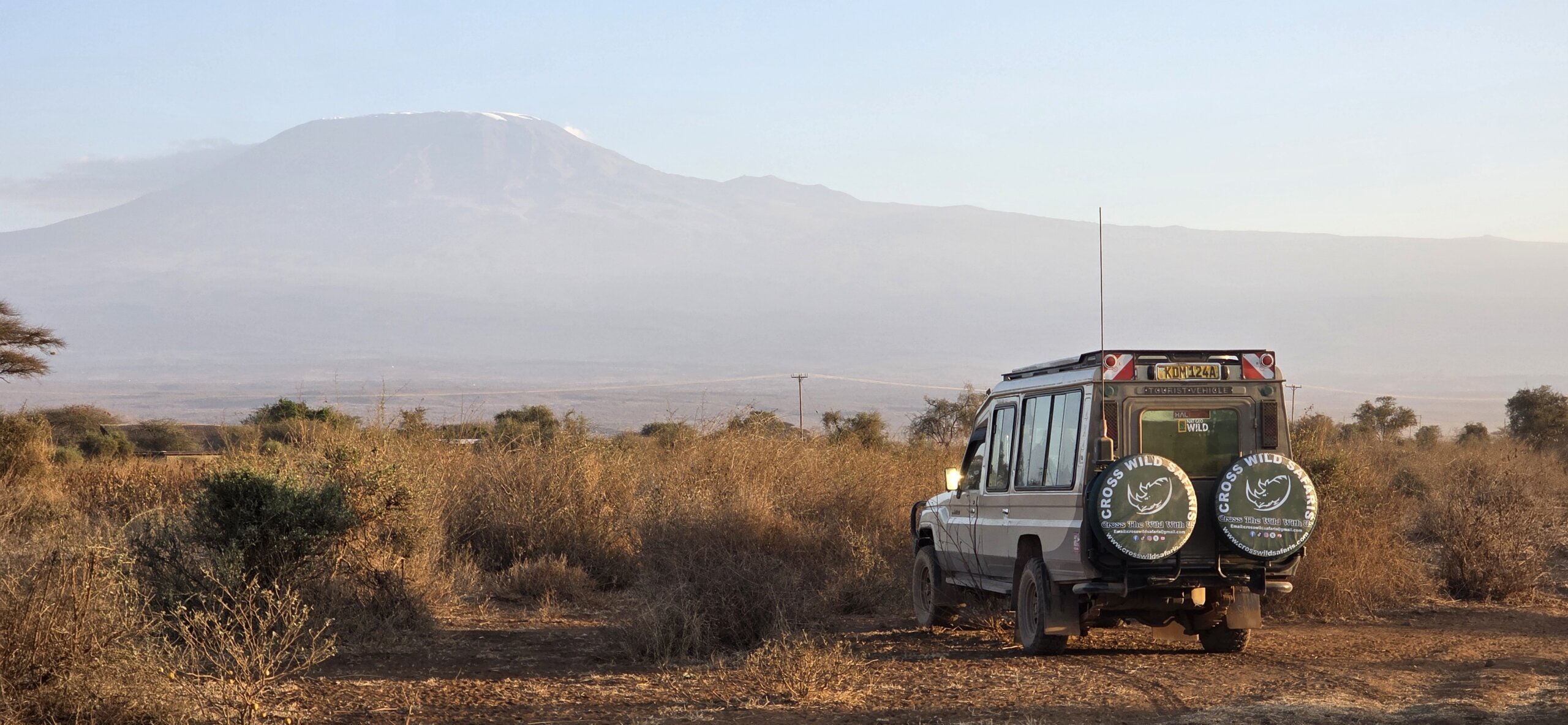 Bush and beach safari with cross wild at Amboseli national park in Kenya
