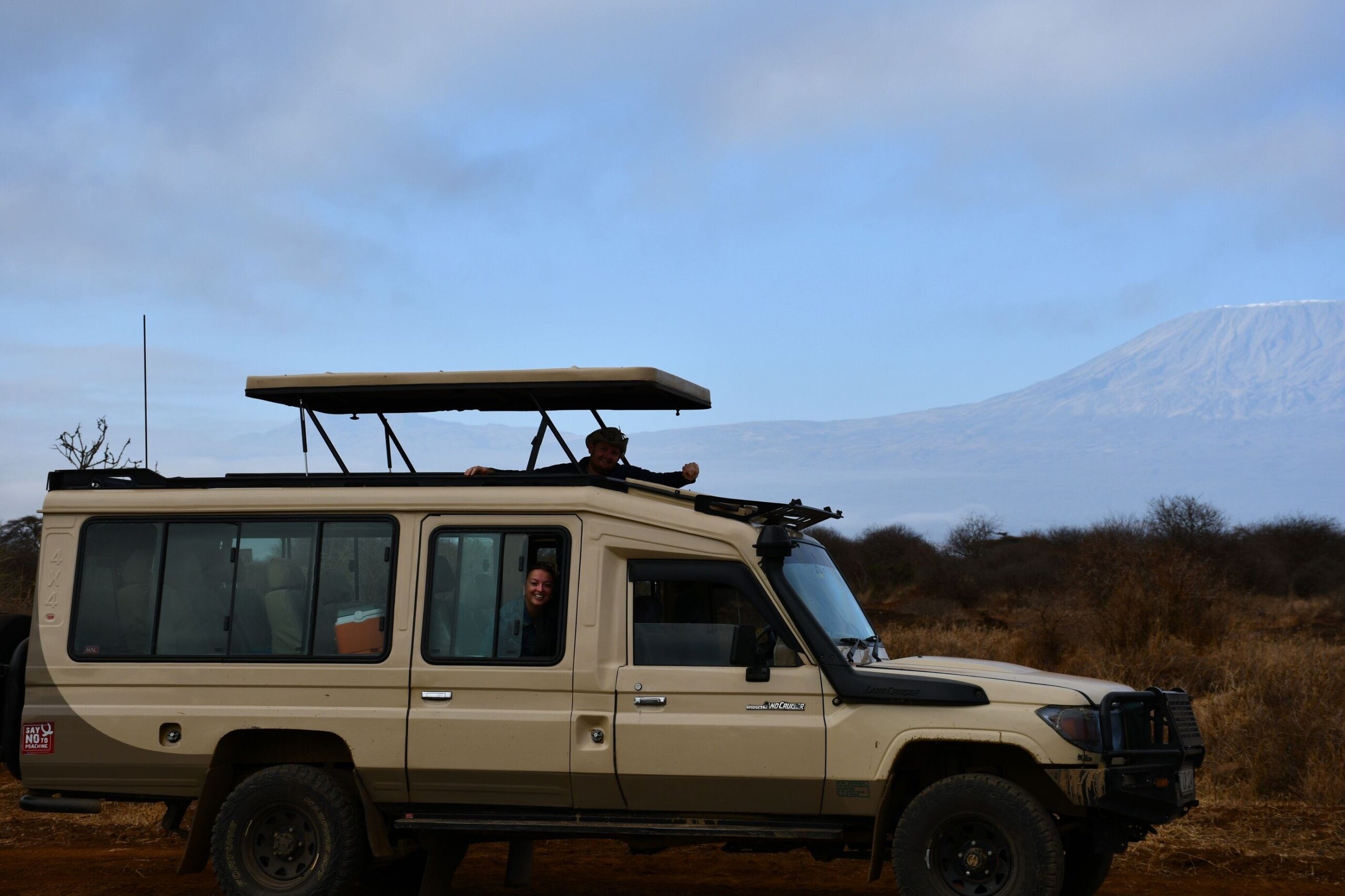 tourists observing mount Kilimanjaro