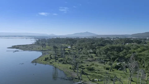 Aerial view of Lake Naivasha surrounded by acacia trees