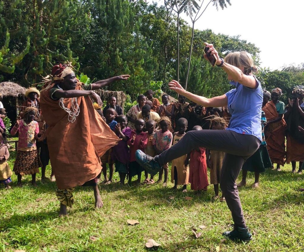 Batwa community dance with tourist near Bwindi Forest.