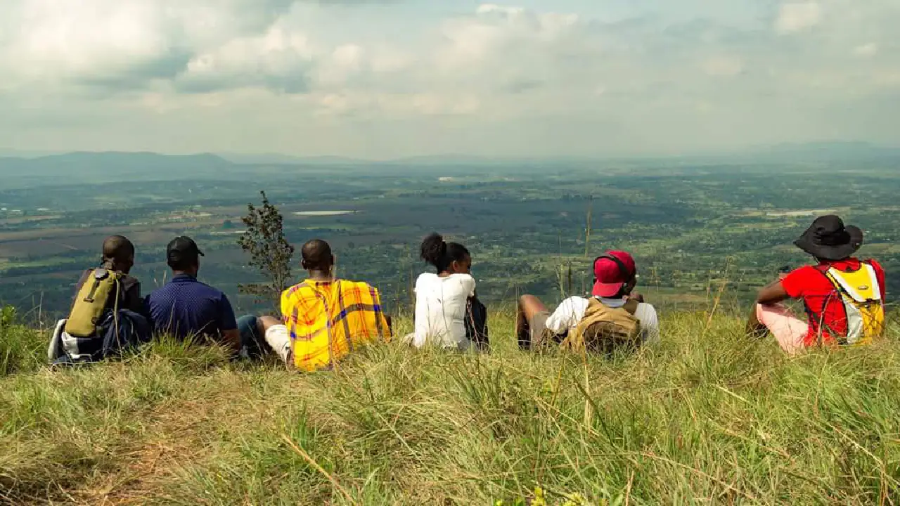 Hikers enjoying a scenic trail on an experience Ol Donyo Sabuk