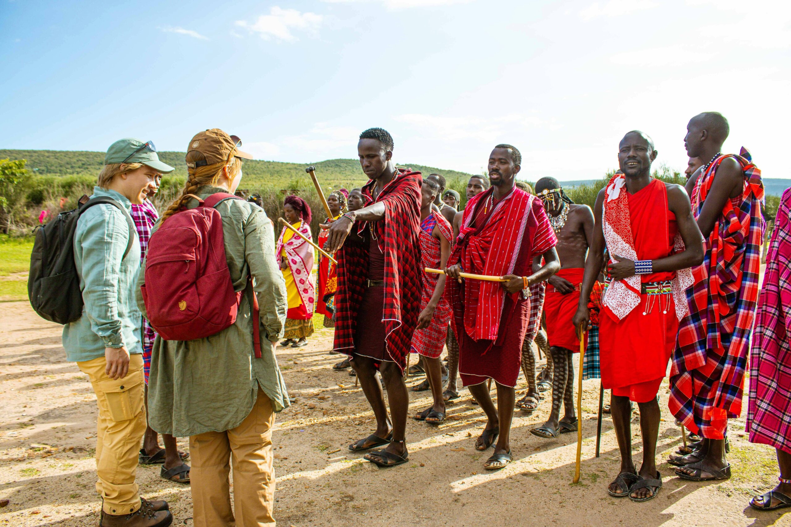 Clients enjoying a visit to the Maasai village on a budget Kenya Safari