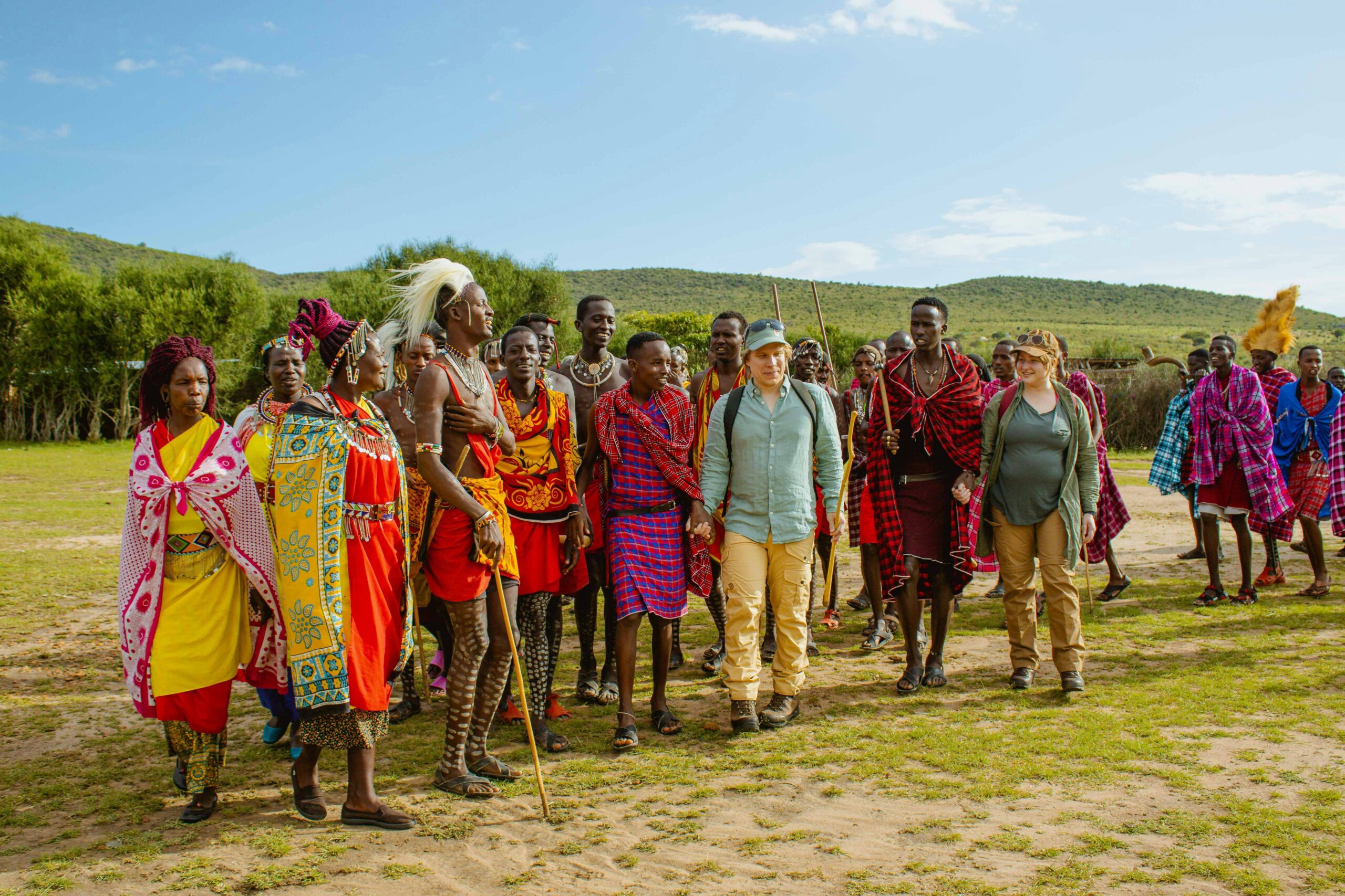 Group photo Cross Wild Safaris guests with a Maasai community
