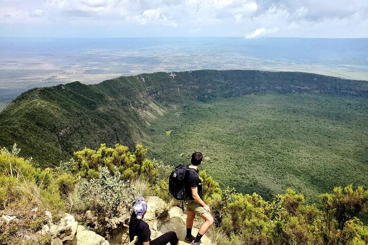 View into the lush green crater of Mount Longonot from the rim