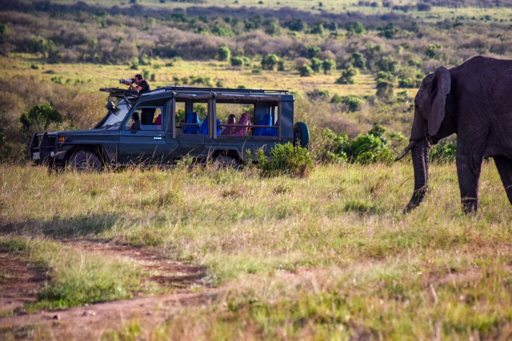 Family enjoying a game drive in the Masai Mara on a classic Kenya safari itinerary