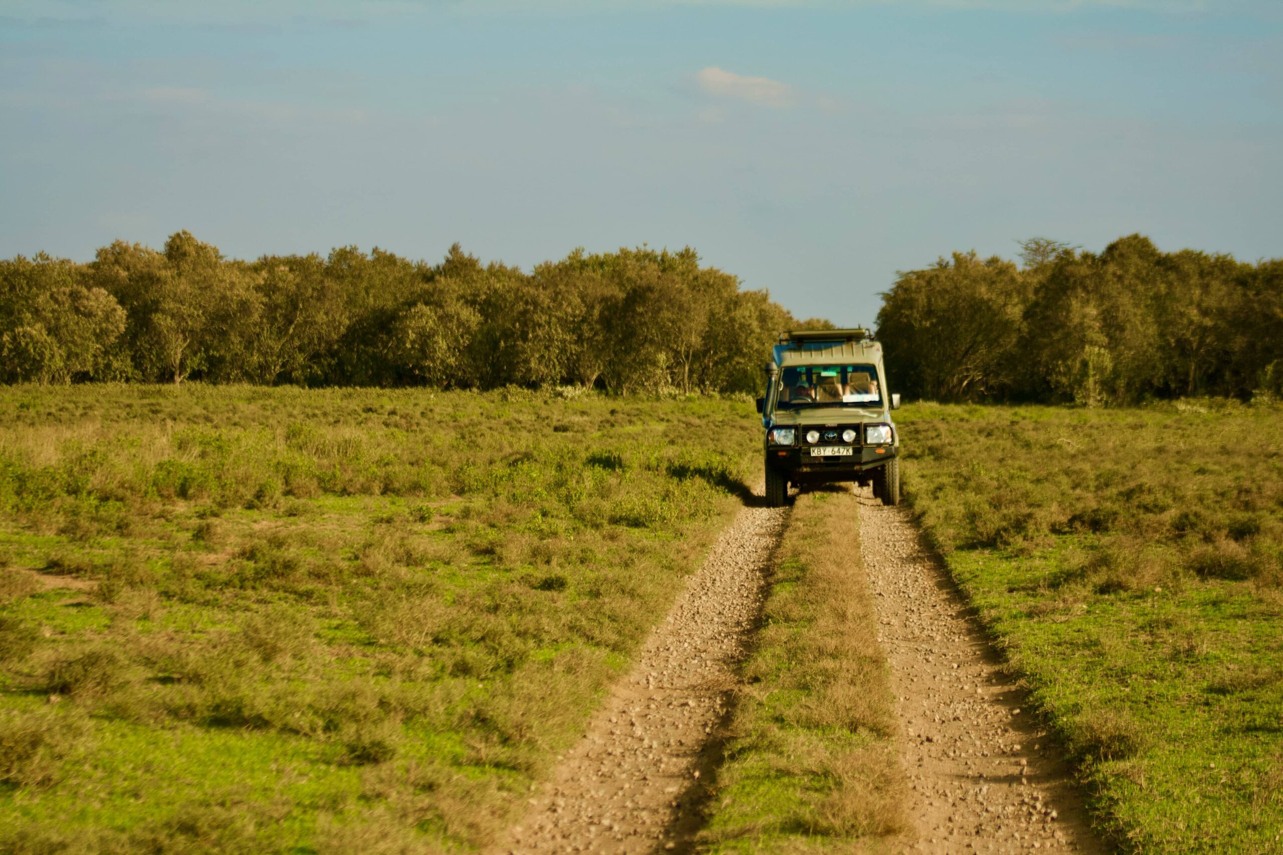 a safari jeep in masai mara - breaking down kenya safari costs -transport