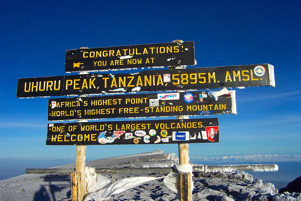 climbing mt Kilimanjaro with cross wild safaris at Tanzania Uhuru Peak at mt Kilimanjaro