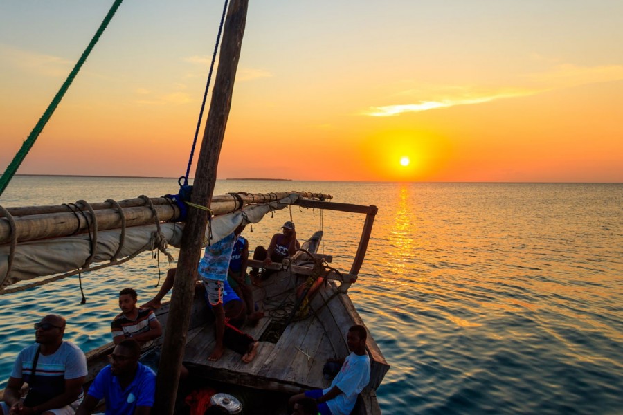 Family enjoying sunset dhow cruise in Zanzibar
