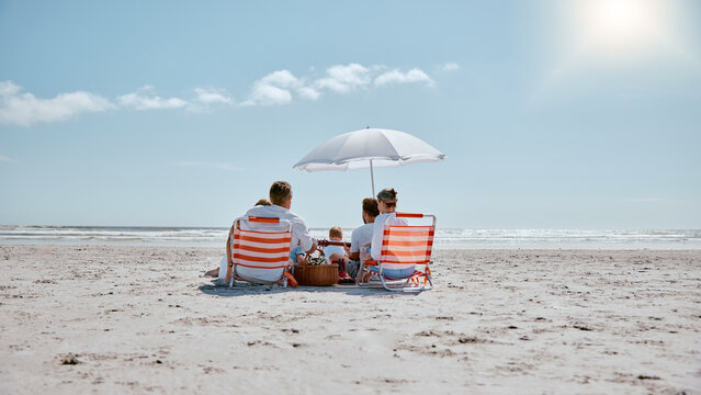Families enjoying Nyali Beach in Mombasa with calm waters and beach umbrellas.