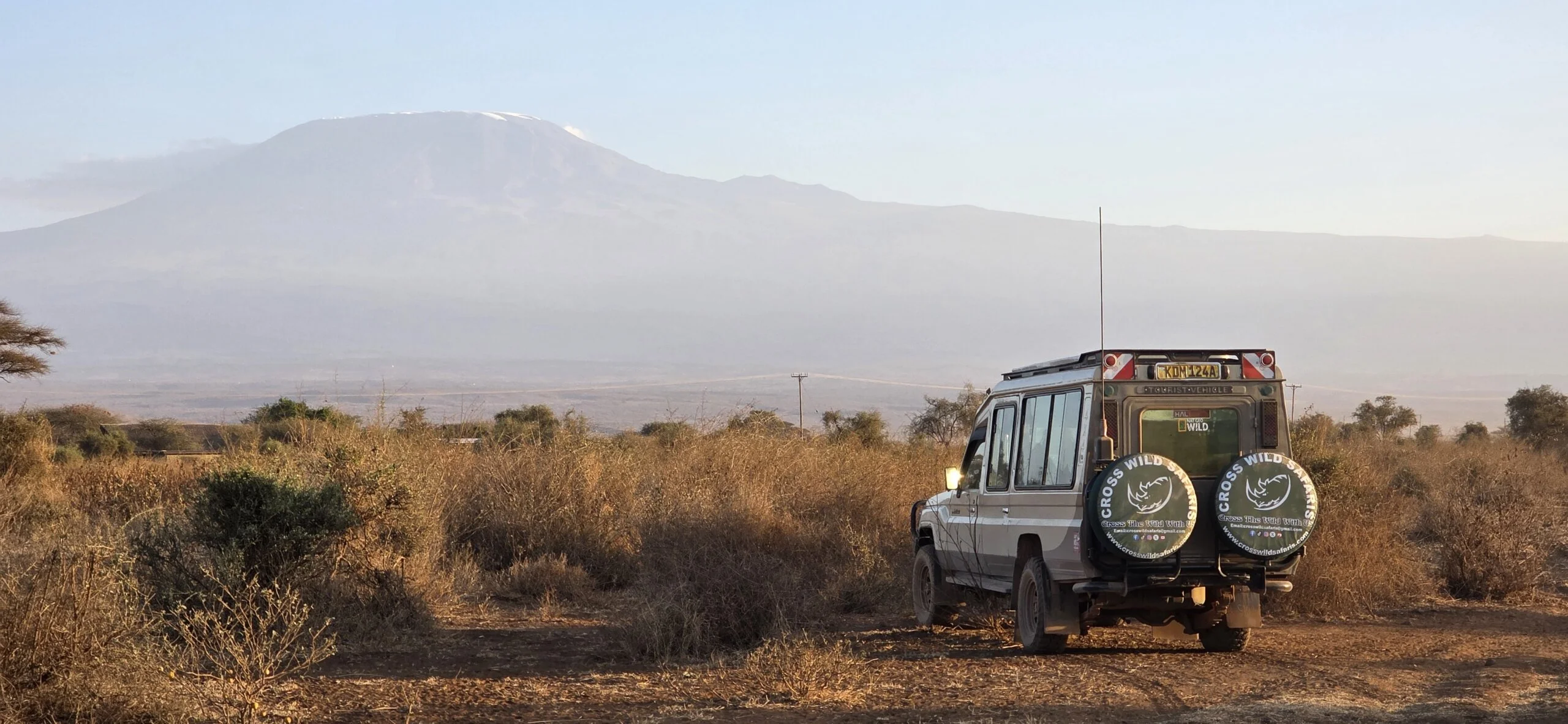 Bush and beach safari with cross wild at Amboseli national park in Kenya