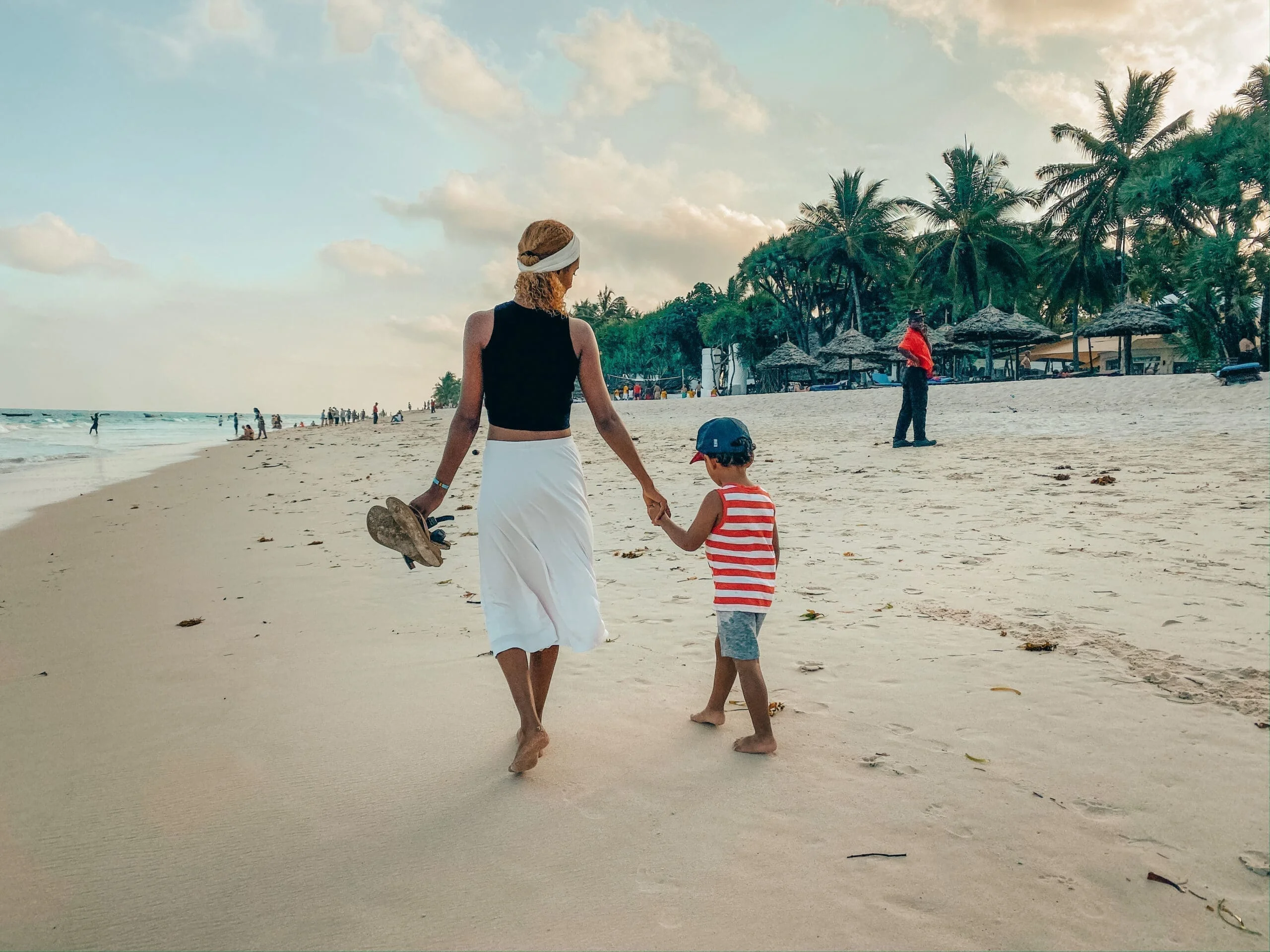 Family enjoying a day at Diani Beach, activities in Mombasa with children building sandcastles