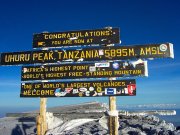 climbing mt Kilimanjaro with cross wild safaris at Tanzania Uhuru Peak at mt Kilimanjaro