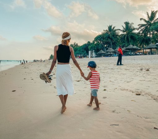 Family enjoying a day at Diani Beach, activities in Mombasa with children building sandcastles