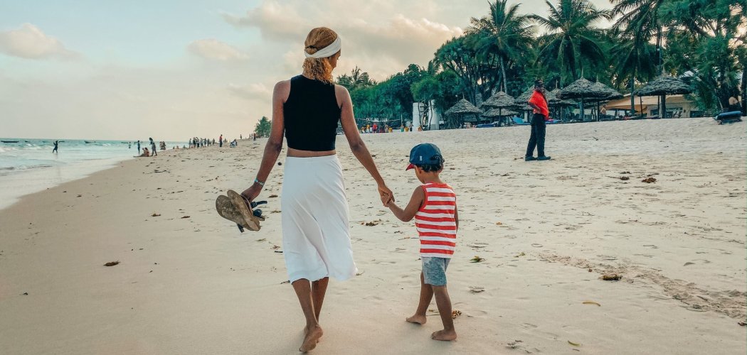 Family enjoying a day at Diani Beach, activities in Mombasa with children building sandcastles