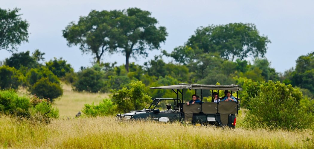 Happy family on a best family safari in Kenya game drive with Cross Wild Safaris